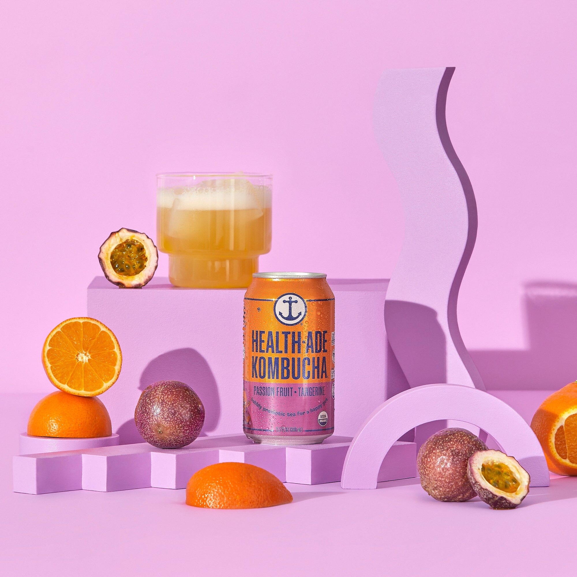 Health-Ade Passion Fruit-Tangerine Kombucha cans lifestyle image