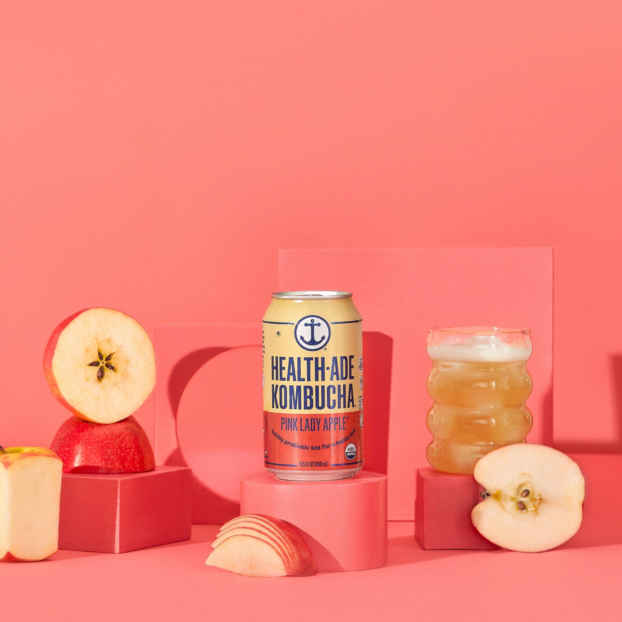 Health-Ade Pink Lady Apple Kombucha cans lifestyle image